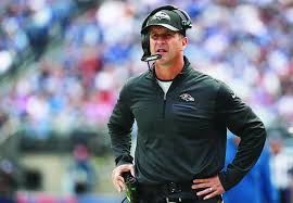 Baltimore Ravens coach John Harbaugh pays the bill for whole seafood restaurant during a Baltimore charity event