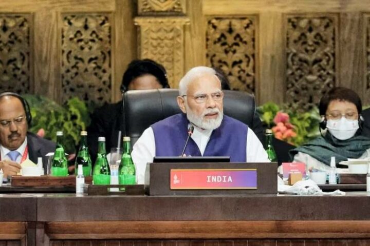 What’s a name worth? India’s PM Modi sits behind a “Bharat” sign at the G20 conference