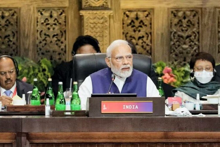 What’s a name worth? India’s PM Modi sits behind a “Bharat” sign at the G20 conference