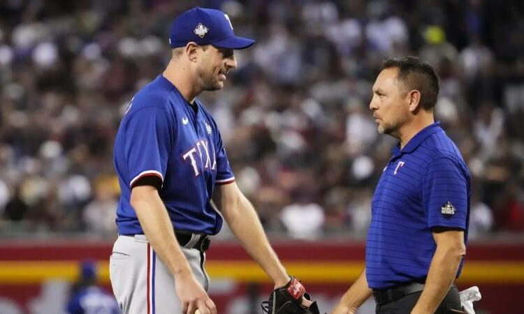 Max Scherzer of the Rangers leaves the World Series Game 3 due to what appears to be a back ailment